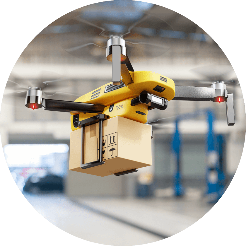 A yellow drone carrying a small brown package is hovering in an indoor environment, with blurred background details suggesting a warehouse or distribution center.