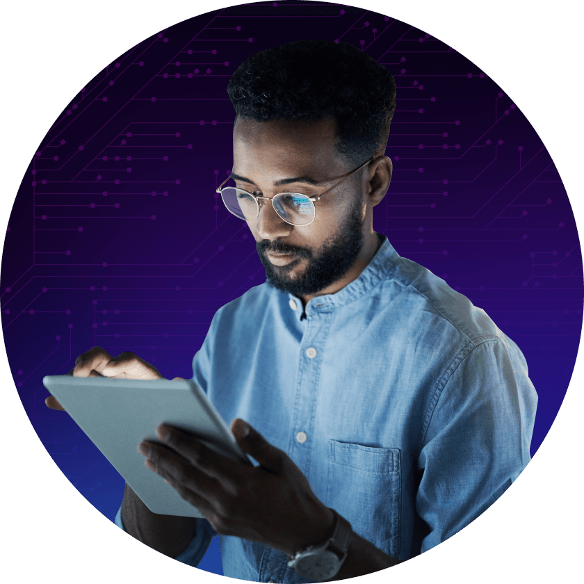 A man wearing glasses uses a tablet device while standing against a purple digital background with circuit patterns.