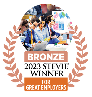 A graphic showcasing a bronze award for 'Best Employers' with an illustration of four professionals collaborating at a meeting table, surrounded by charts and graphs.