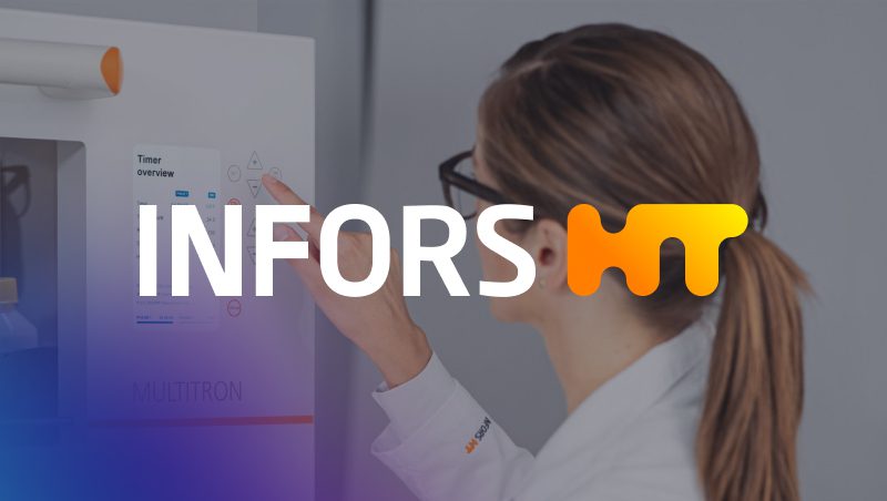 A woman in a lab coat adjusting the settings on a laboratory machine, with the logo 'INFORS HT' prominently displayed in the foreground.