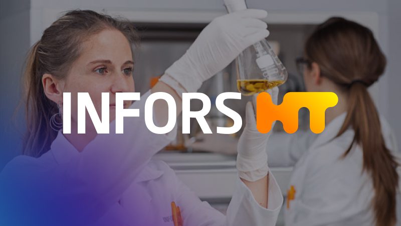 A woman in a lab coat holding a glass flask containing a yellow liquid, focusing on the experiment. In the background, another lab worker is visible. The foreground features the text 'INFORS HT' in stylized font.