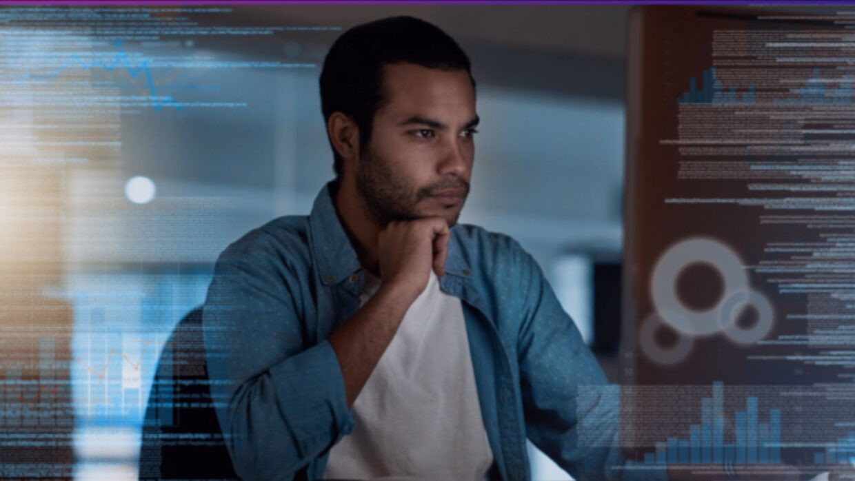 A man sitting at a desk, observing data visualizations and digital analytics on a screen. The background includes abstract data patterns, emphasizing the theme that 'Cybersecurity is Everyone's Job'.