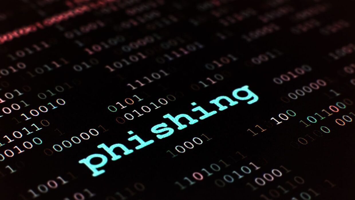 The word 'phishing' displayed in light blue against a dark background filled with binary code, emphasizing the theme of phishing research.