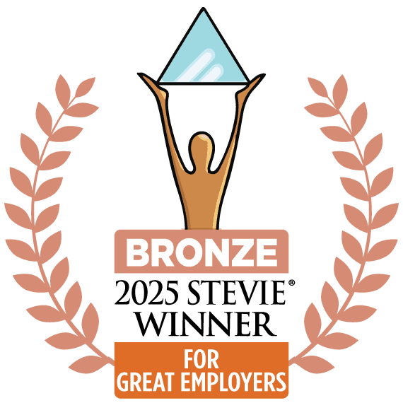 A graphic featuring a bronze award symbol with a stylized figure holding a blue pyramid. Text below reads "2023 Silver Winner for Great Employers".