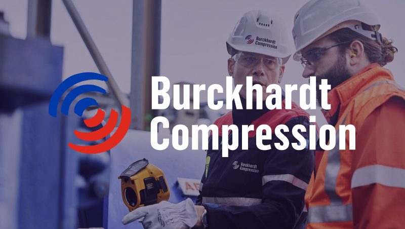 Two workers discussing equipment while wearing safety gear, with a logo for Burckhardt Compression overlayed in the foreground.
