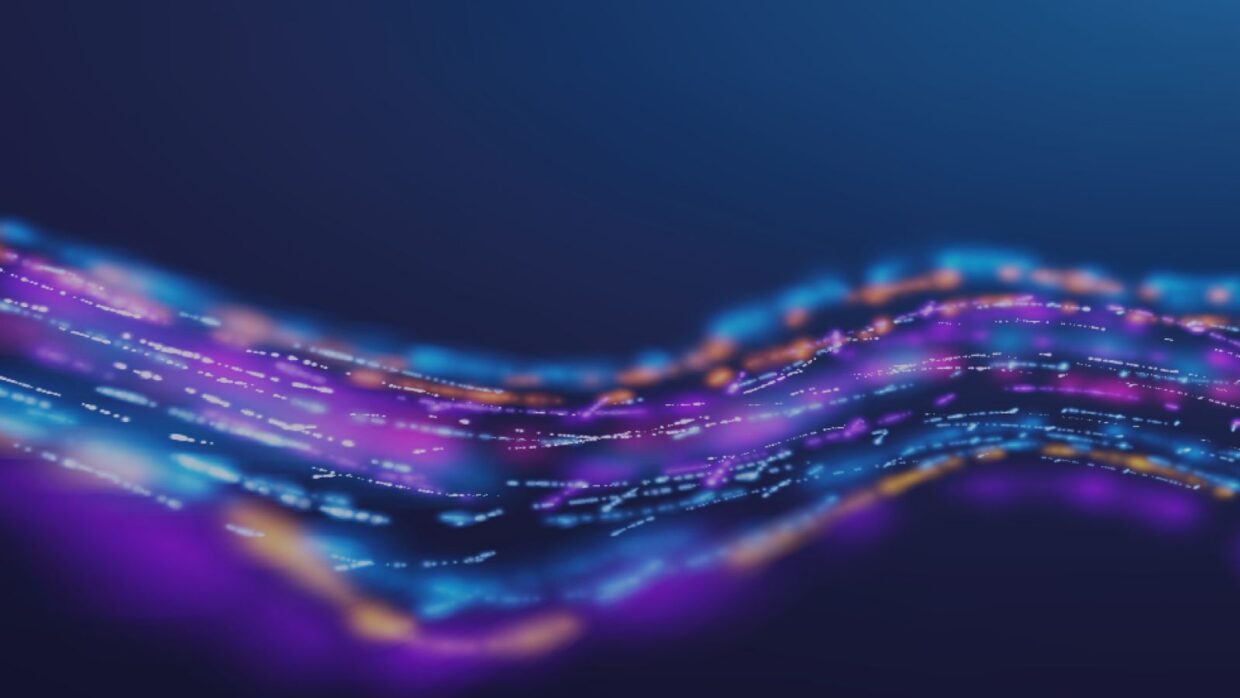 An abstract digital illustration featuring swirling lines in vibrant shades of purple, blue, and orange, set against a dark background. The lines resemble flowing data streams or light patterns.